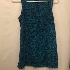 Turquoise ruffled tank style blouse.